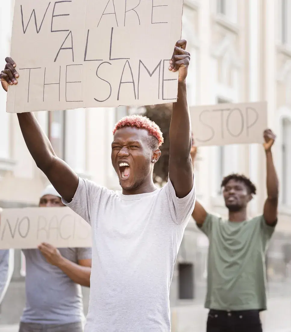 Demonstrators holding placards