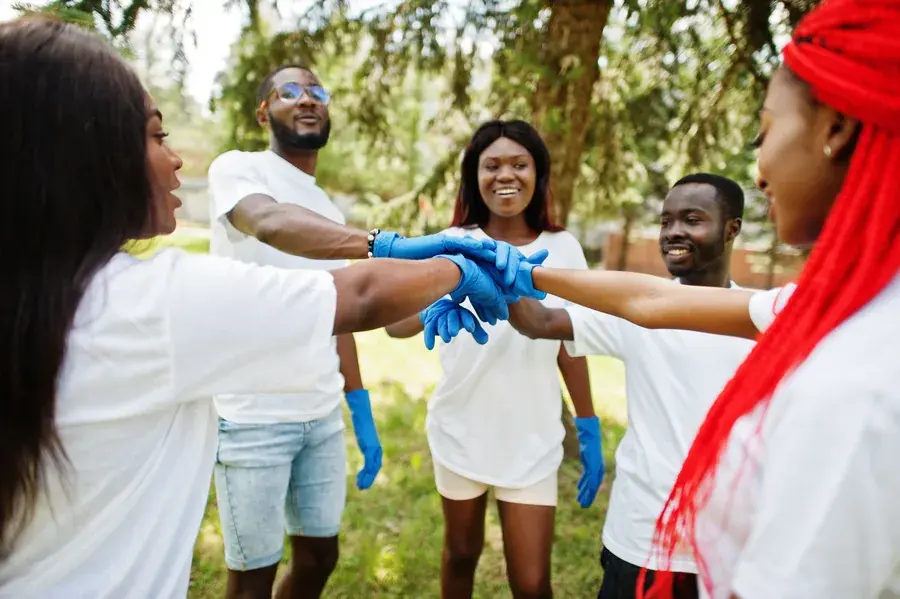 Volunteers joining hands