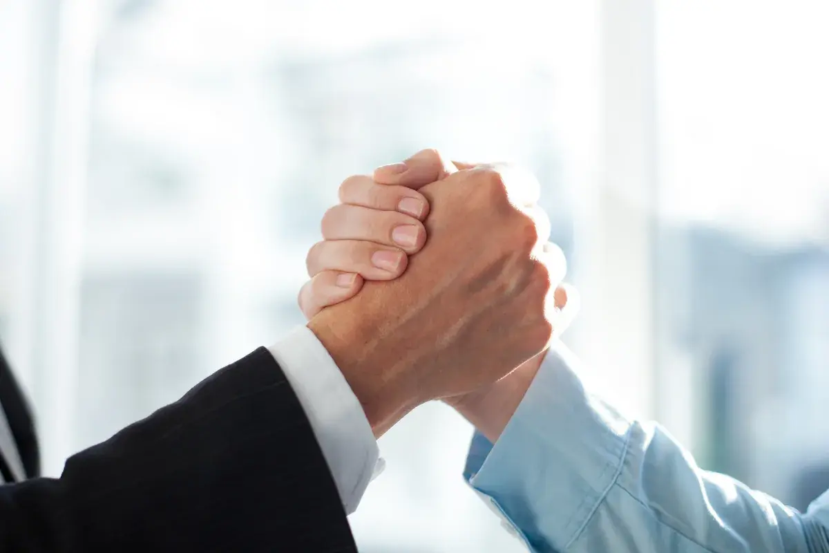 Two people shaking hands